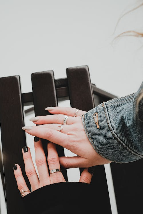 Woman placing her hands on a chair, showing elevated manicure in Columbus